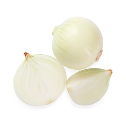 Whole and cut onions on white background, top view