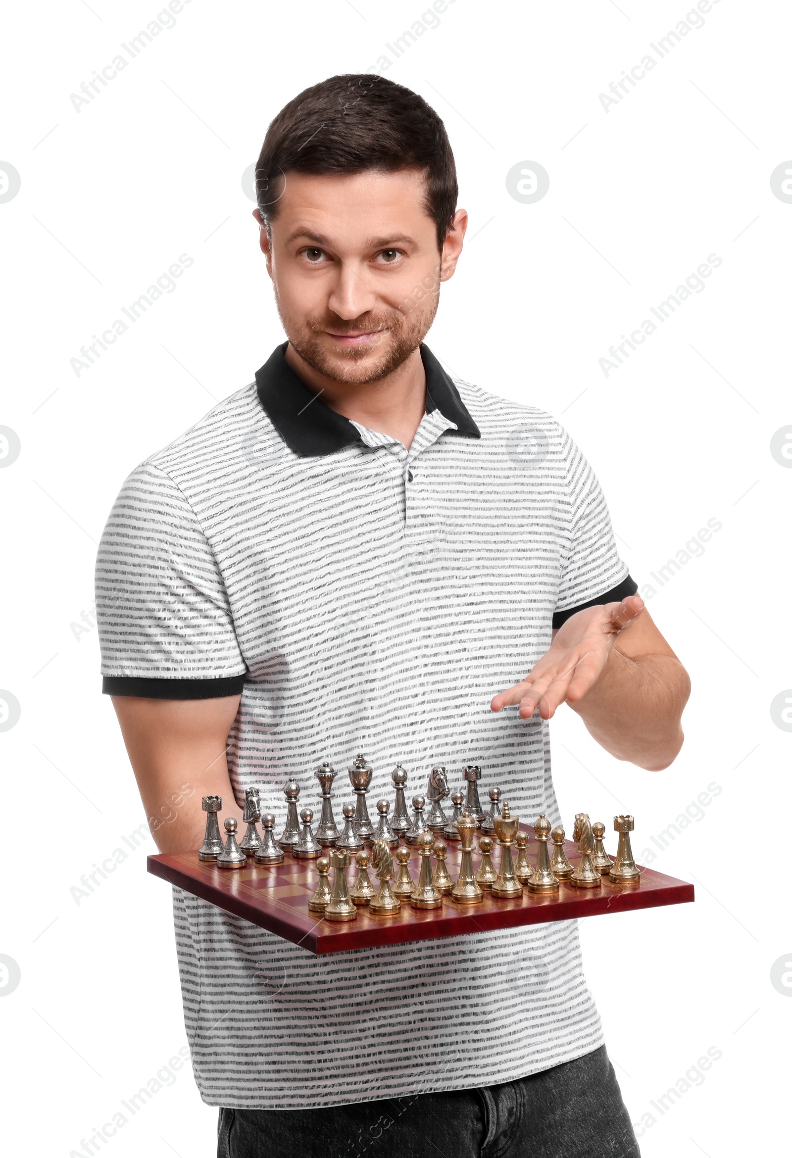 Photo of Smiling man showing chessboard with game pieces on white background