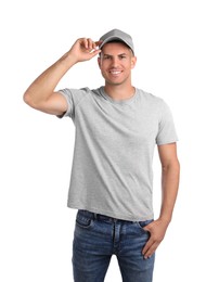 Photo of Happy man in grey cap and tshirt on white background. Mockup for design