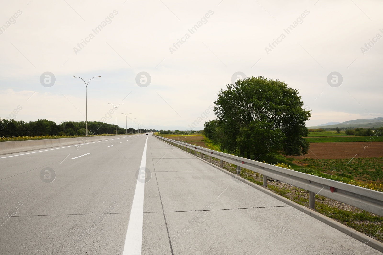 Photo of Picturesque view of asphalt road on cloudy day