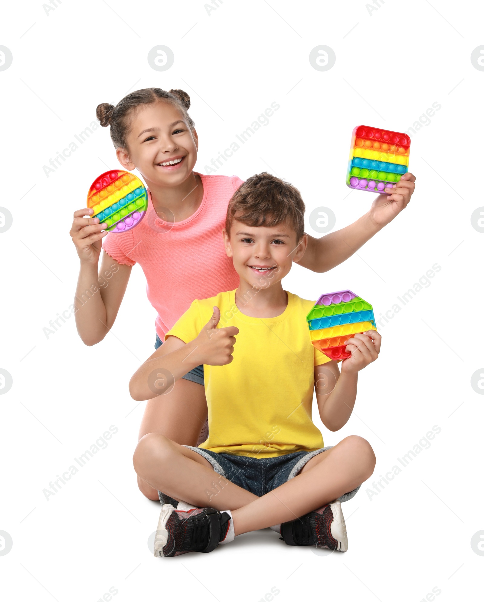 Photo of Children with pop it fidget toys on white background