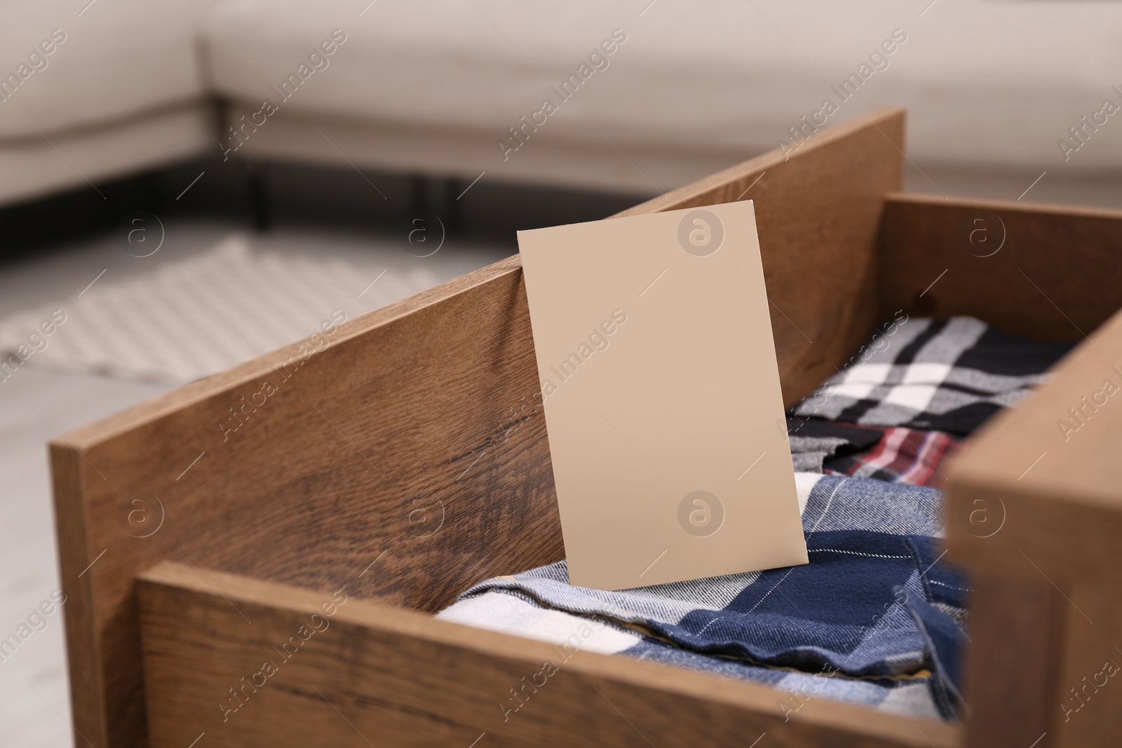 Photo of Scented sachet and folded clothes in drawer