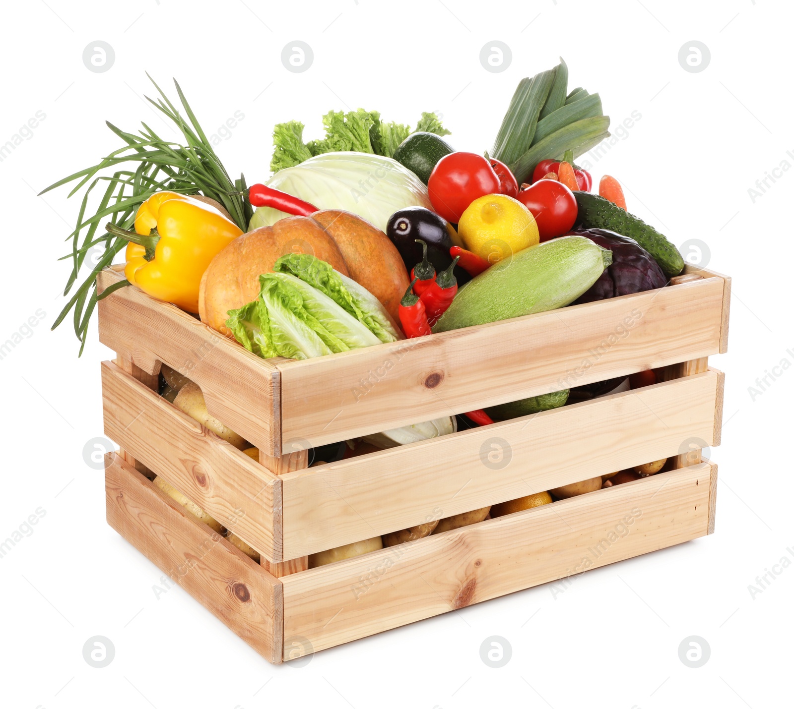 Photo of Fresh ripe vegetables and fruit in wooden crate on white background