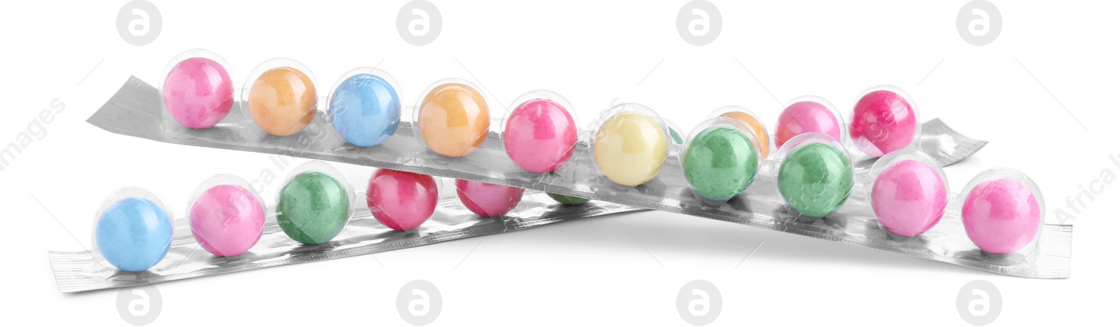 Photo of Packages with many bright gumballs isolated on white