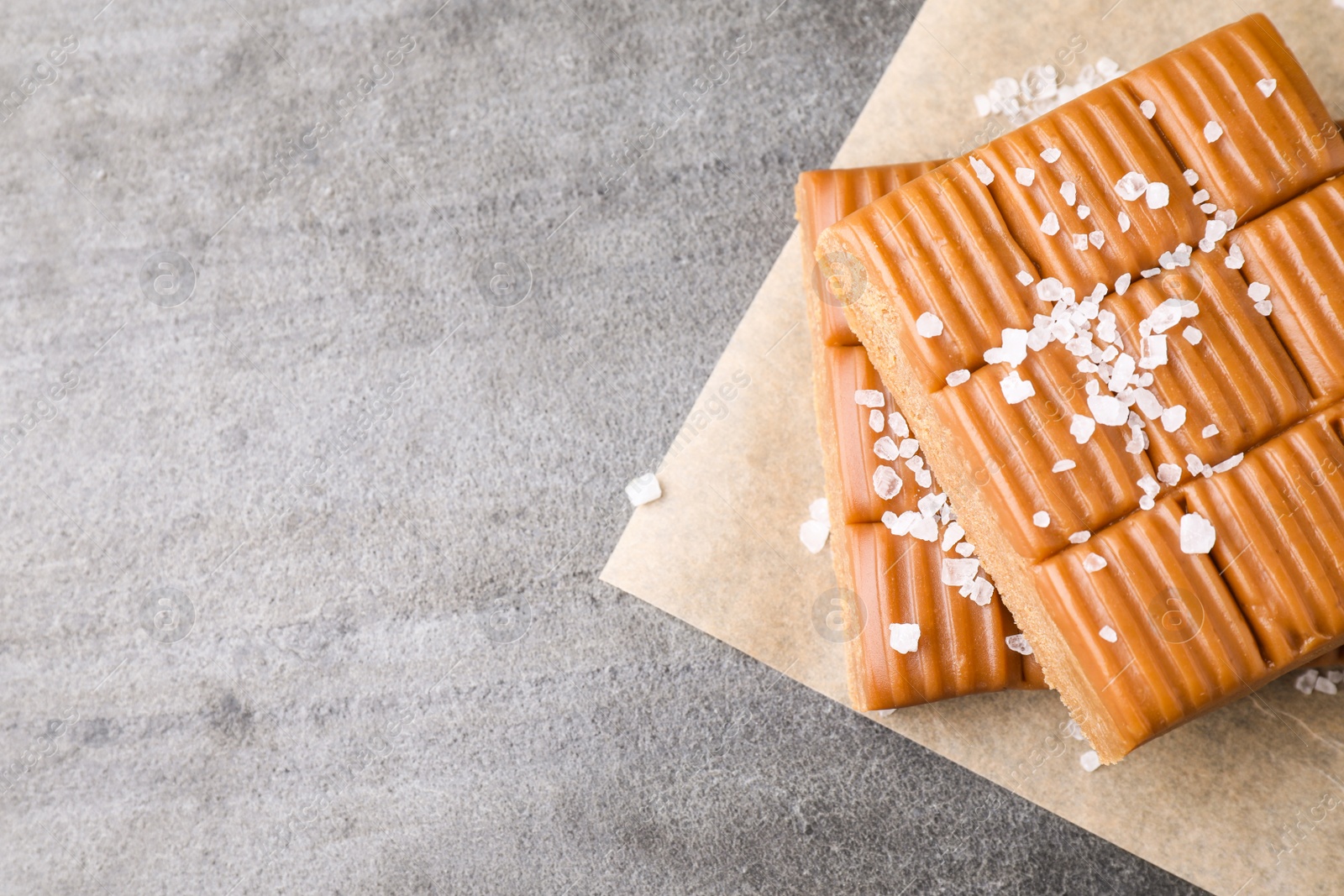 Photo of Salted caramel on light grey table, top view. Space for text