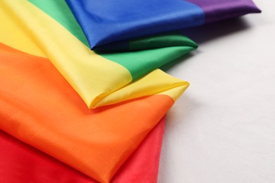 Photo of Rainbow LGBT flag on white background, closeup