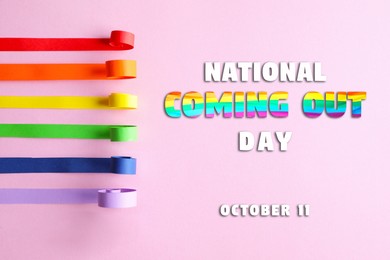 Image of National Coming Out day, October 11. Ribbons in rainbow colors making pride flag on pink background, flat lay