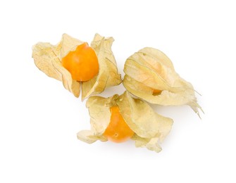 Photo of Ripe physalis fruits with calyxes isolated on white, top view