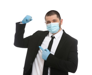 Photo of Businessman with protective mask and gloves showing muscles on white background. Strong immunity concept