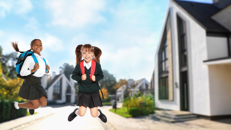 Image of Happy girls jumping near house, space for text. School holidays