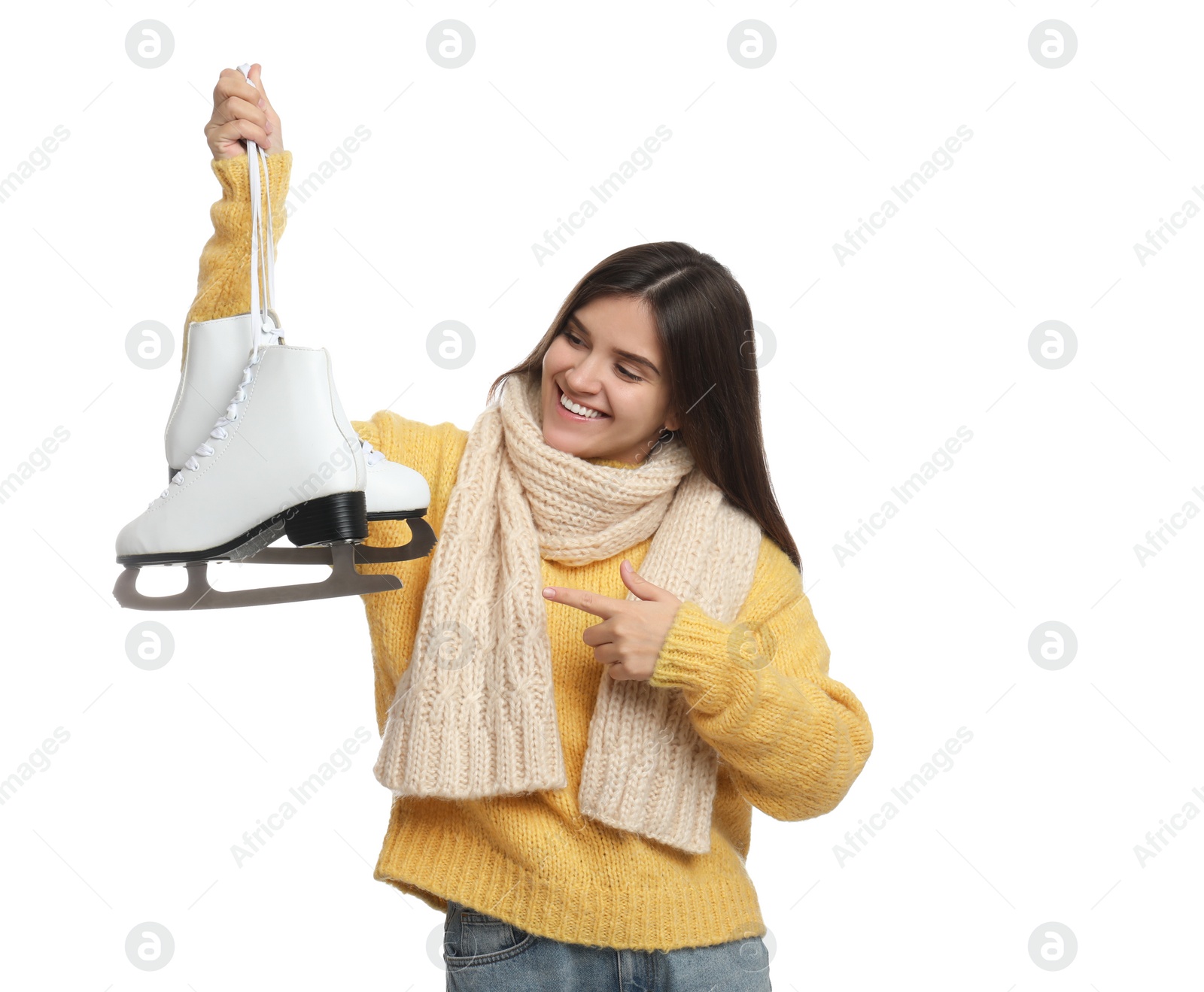 Photo of Happy woman with ice skates on white background