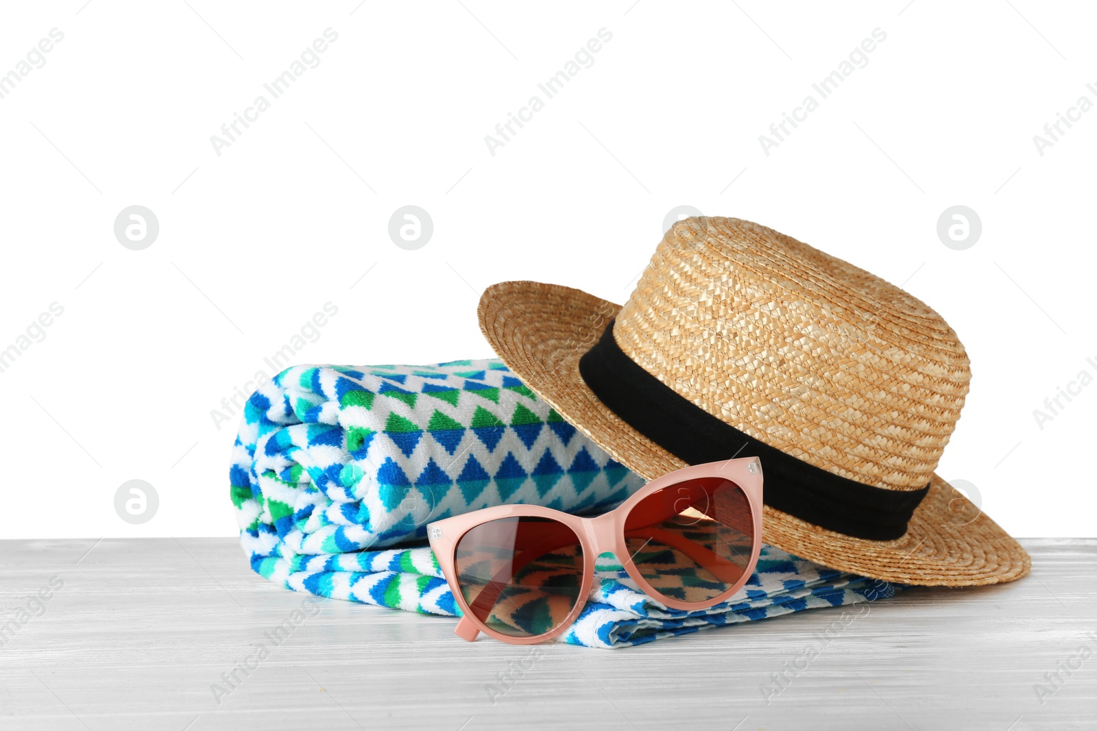 Photo of Set of beach accessories on table against white background. Space for text