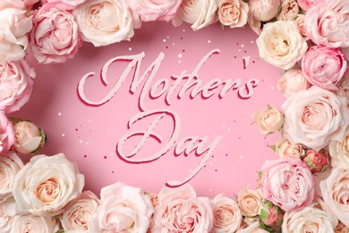 Image of Happy Mother's Day. Beautiful roses on pink background, flat lay