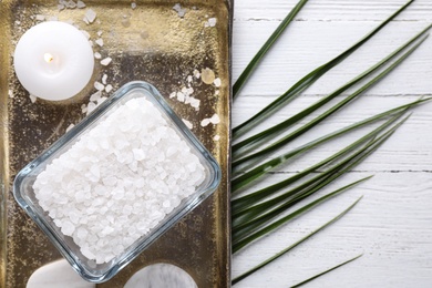 Photo of Flat lay composition with sea salt on white wooden background, space for text. Spa treatment