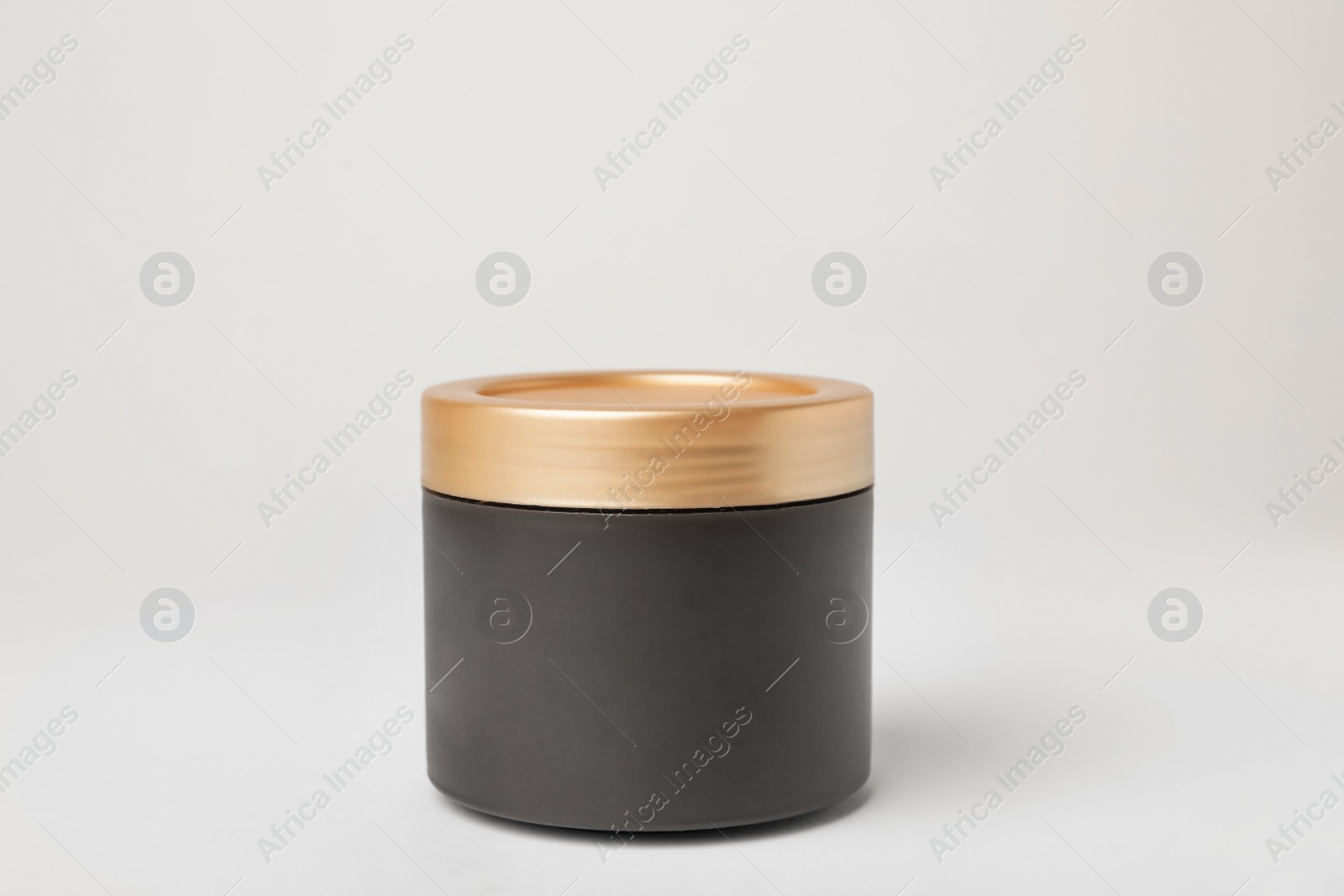 Photo of Jar of cosmetic product on light background