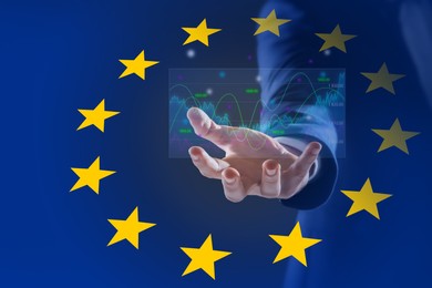 Image of Stock exchange. Double exposure with European flag and man holding digital trading graphs