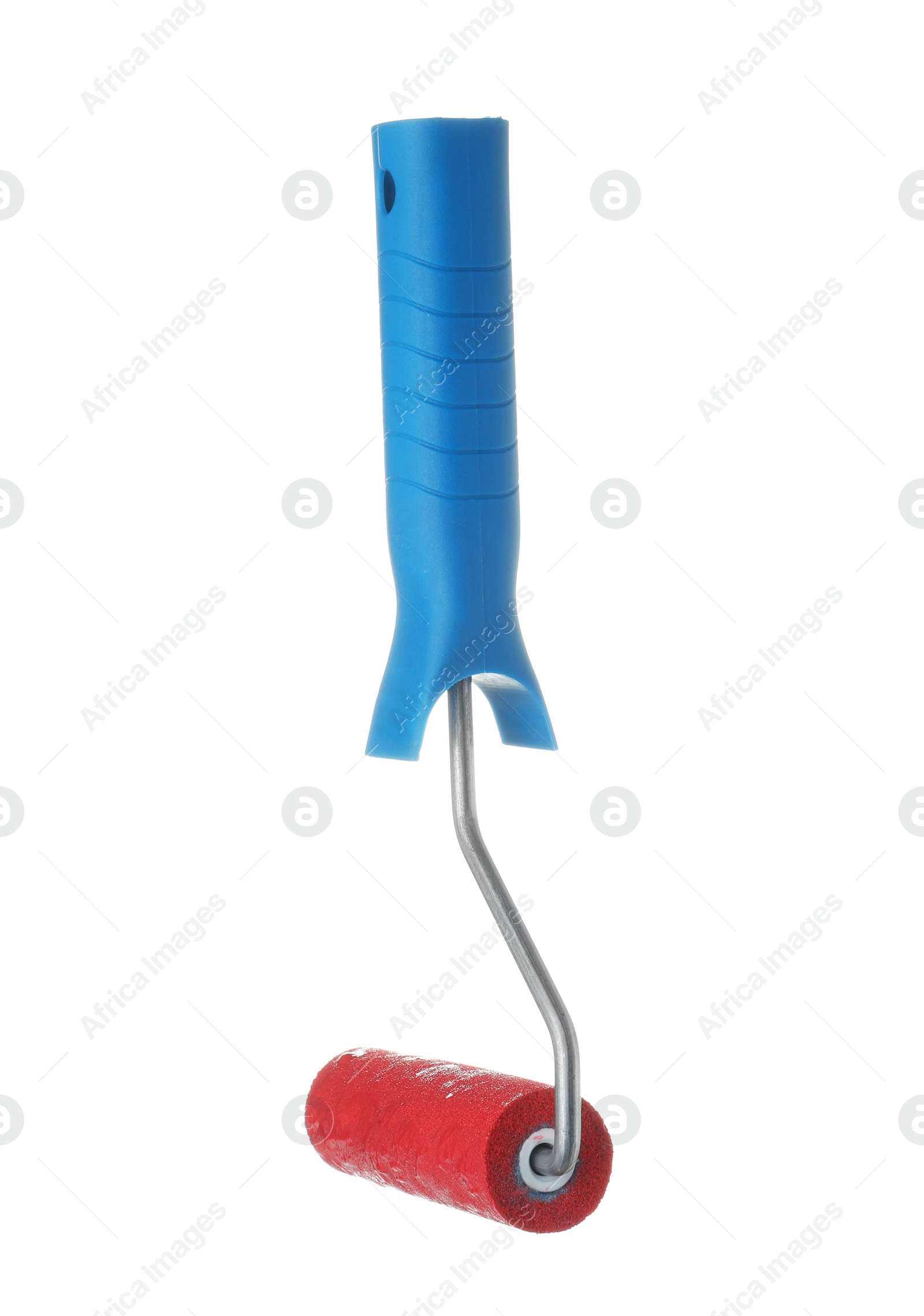 Photo of Roller brush with red paint on white background