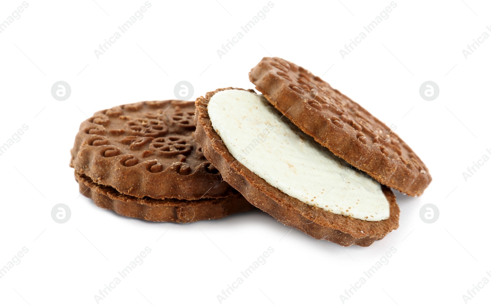 Photo of Tasty chocolate sandwich cookies with cream on white background