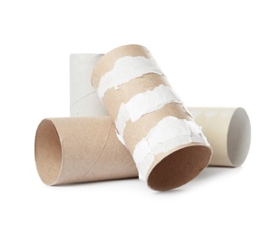 Empty toilet paper rolls on white background