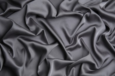 Photo of Texture of delicate black silk as background, top view