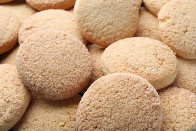 Photo of Tasty sugar cookies as background, closeup view