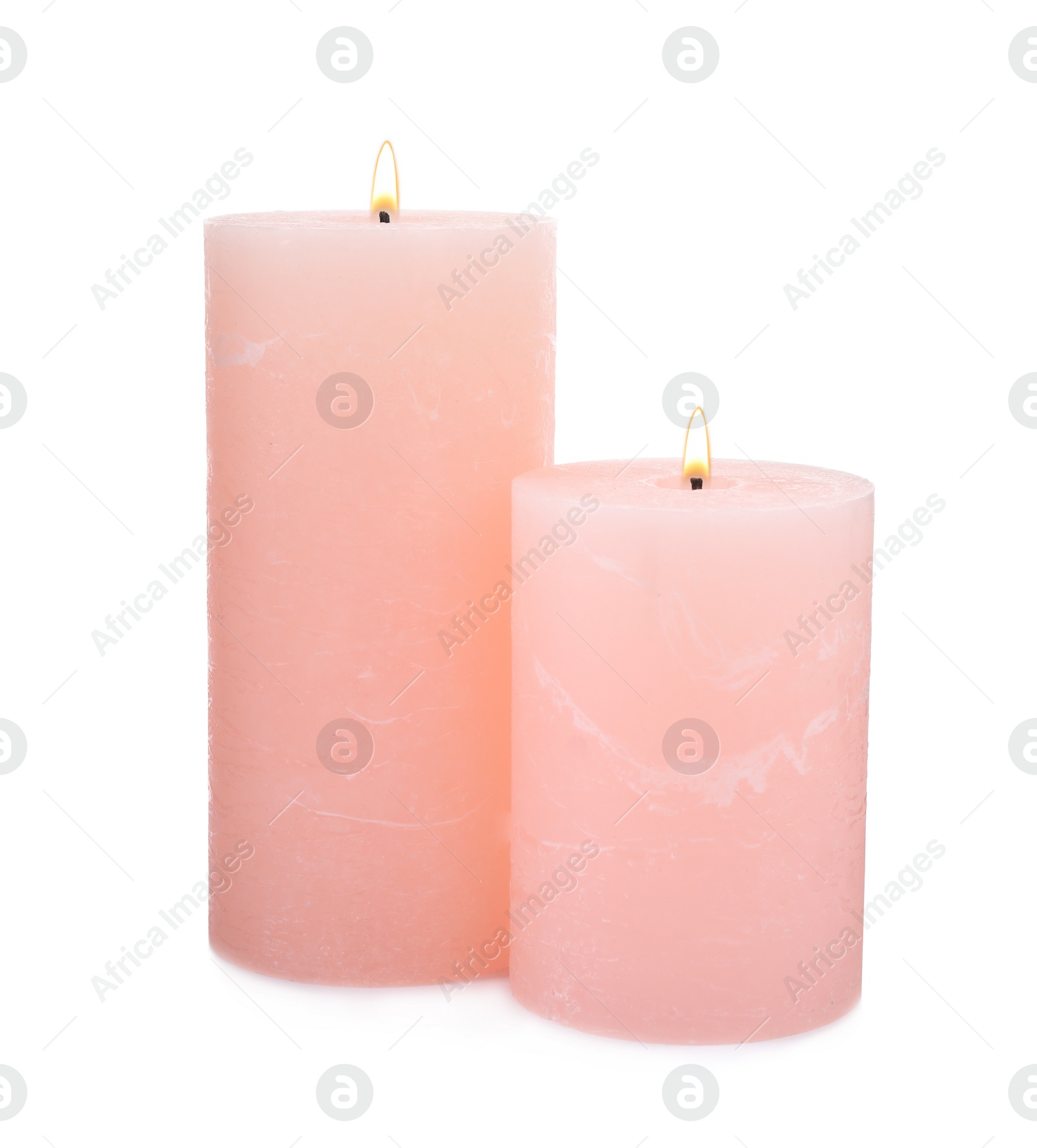 Photo of Burning pink wax candles on white background