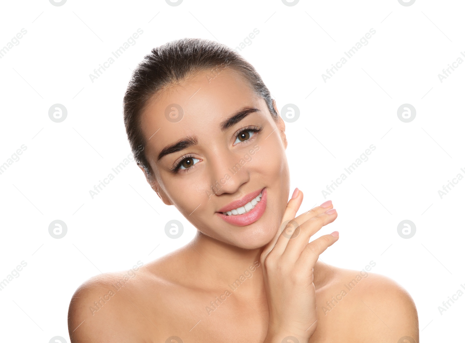 Photo of Portrait of young woman with foundation on her face against white background