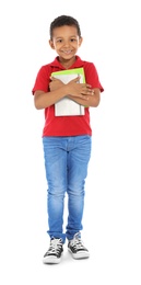 Little African-American child with school supplies on white background