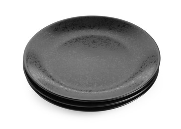 Photo of Three black ceramic plates isolated on white