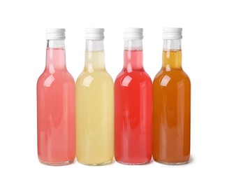 Delicious kombucha in glass bottles isolated on white