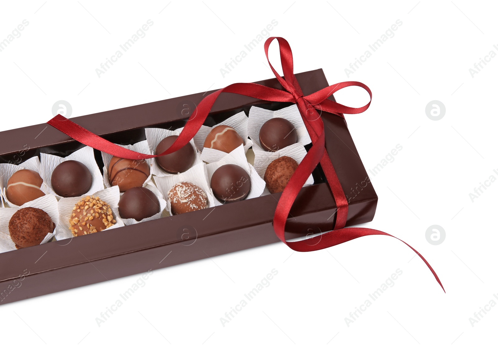 Photo of Box with delicious chocolate candies isolated on white