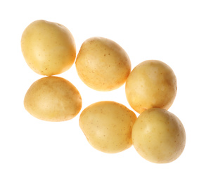 Photo of Fresh raw organic potatoes on white background, top view