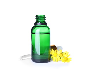 Photo of Bottle of herbal essential oil, pipette and flowers isolated on white