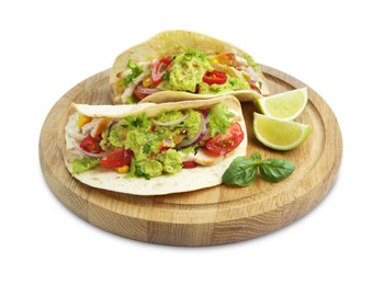 Delicious tacos with guacamole, meat, vegetables and slices of lime isolated on white