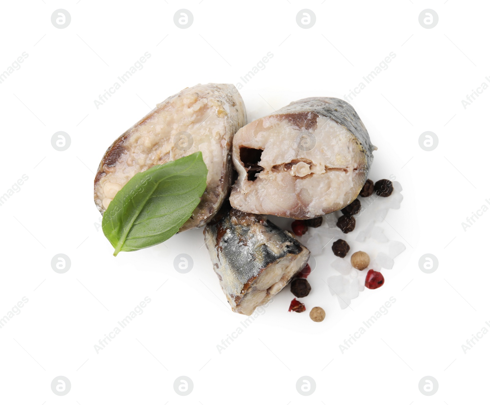 Photo of Canned mackerel chunks with basil and peppercorns on white background, top view