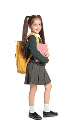 Little girl in stylish school uniform on white background