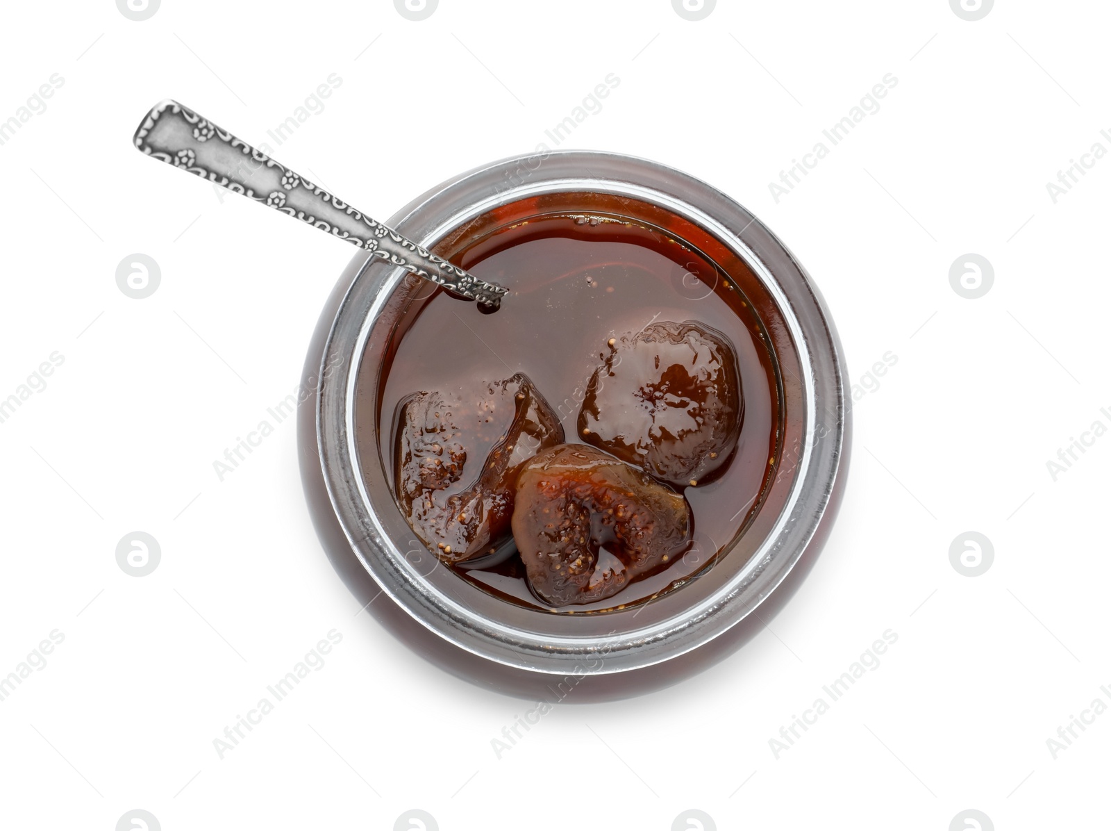 Photo of Jar of tasty sweet fig jam and spoon isolated on white, top view