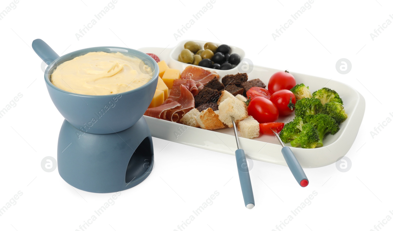 Photo of Fondue with tasty melted cheese, forks and different snacks isolated on white