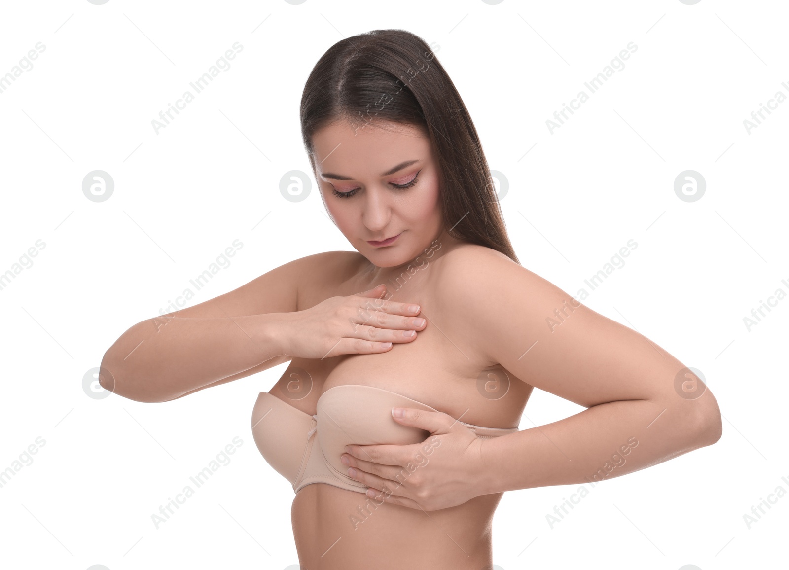 Photo of Mammology. Woman in bra doing breast self-examination on white background