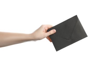 Woman holding black paper envelope on white background, closeup