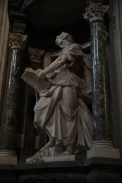 ROME, ITALY - FEBRUARY 2, 2024: Statue of st. Matthew apostle in Basilica of St. John Lateran
