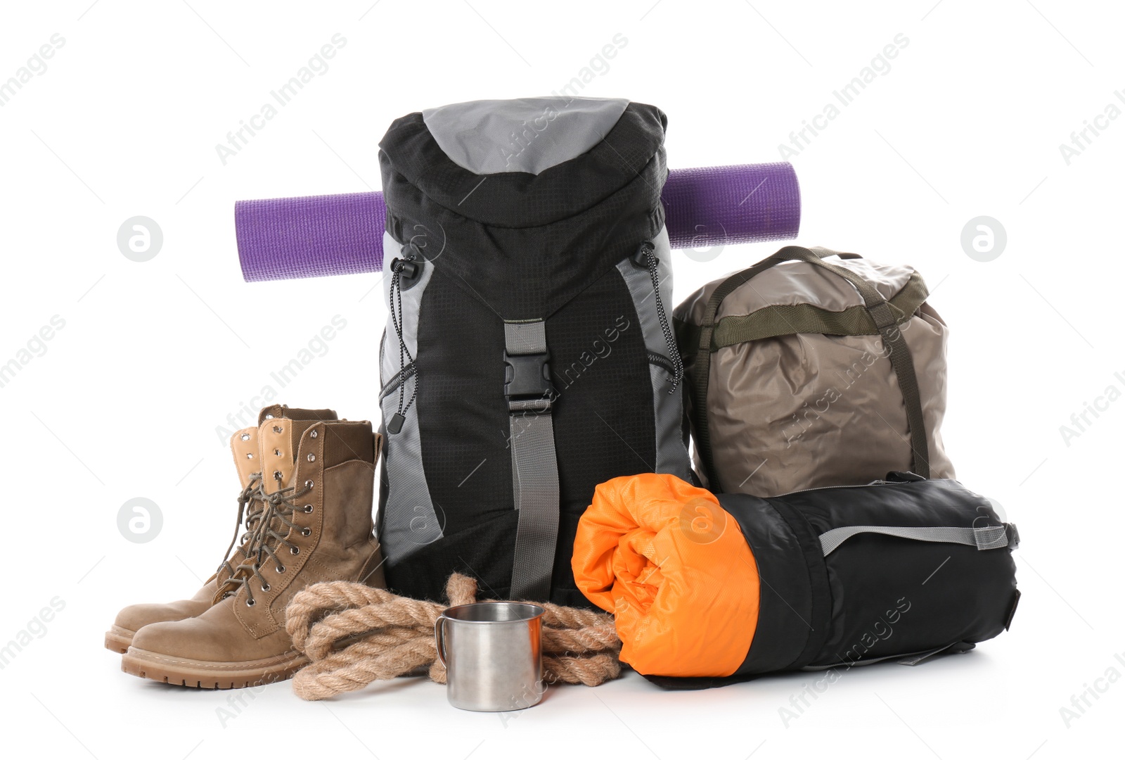 Photo of Set of camping equipment with sleeping bag on white background