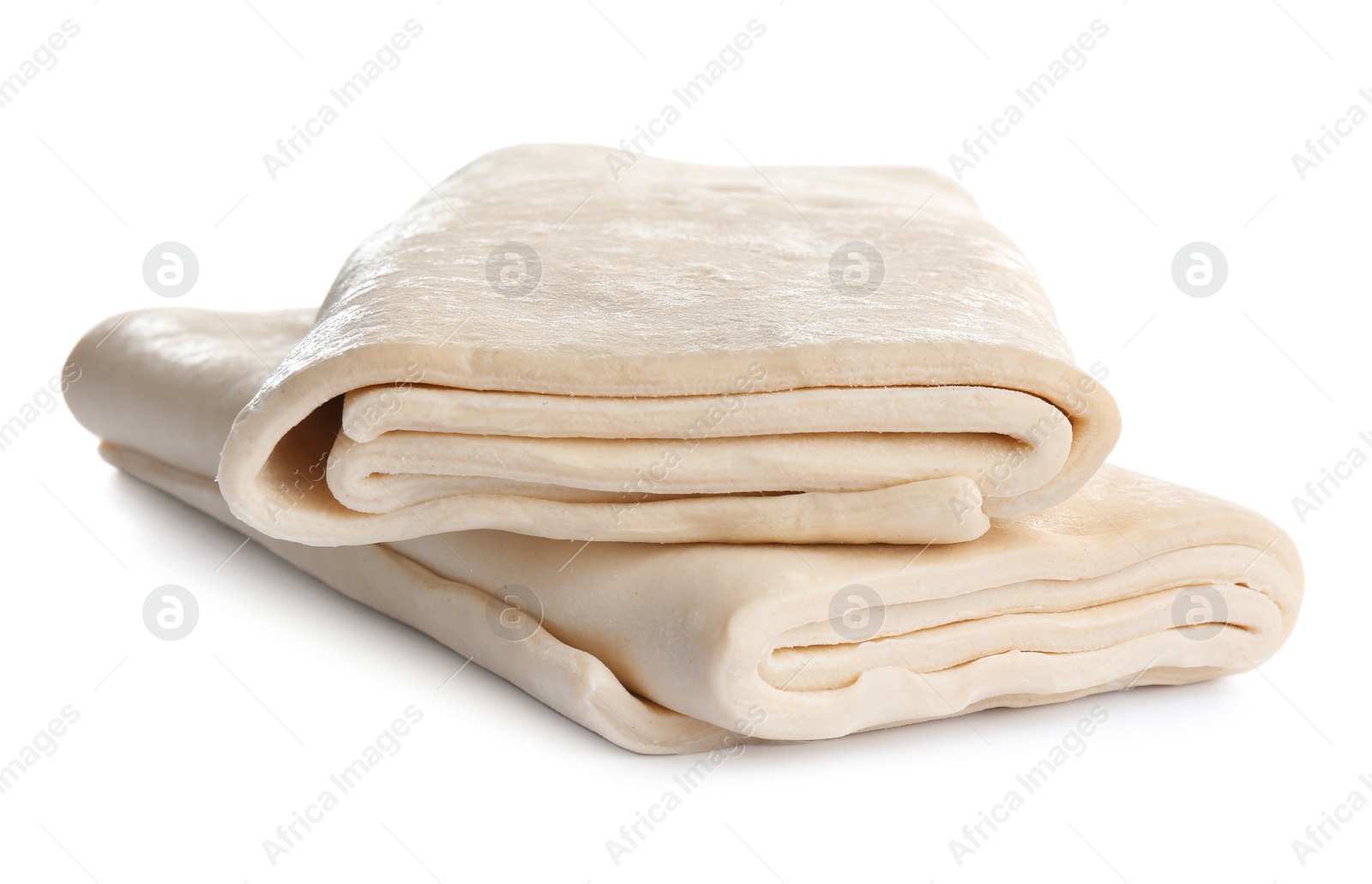 Photo of Fresh dough on white background. Puff pastry