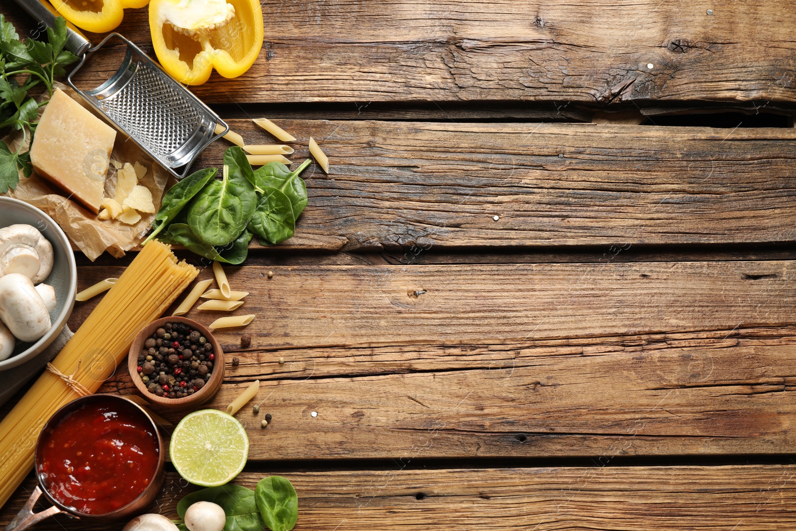 Photo of Flat lay composition with fresh products on wooden table, space for text. Healthy cooking