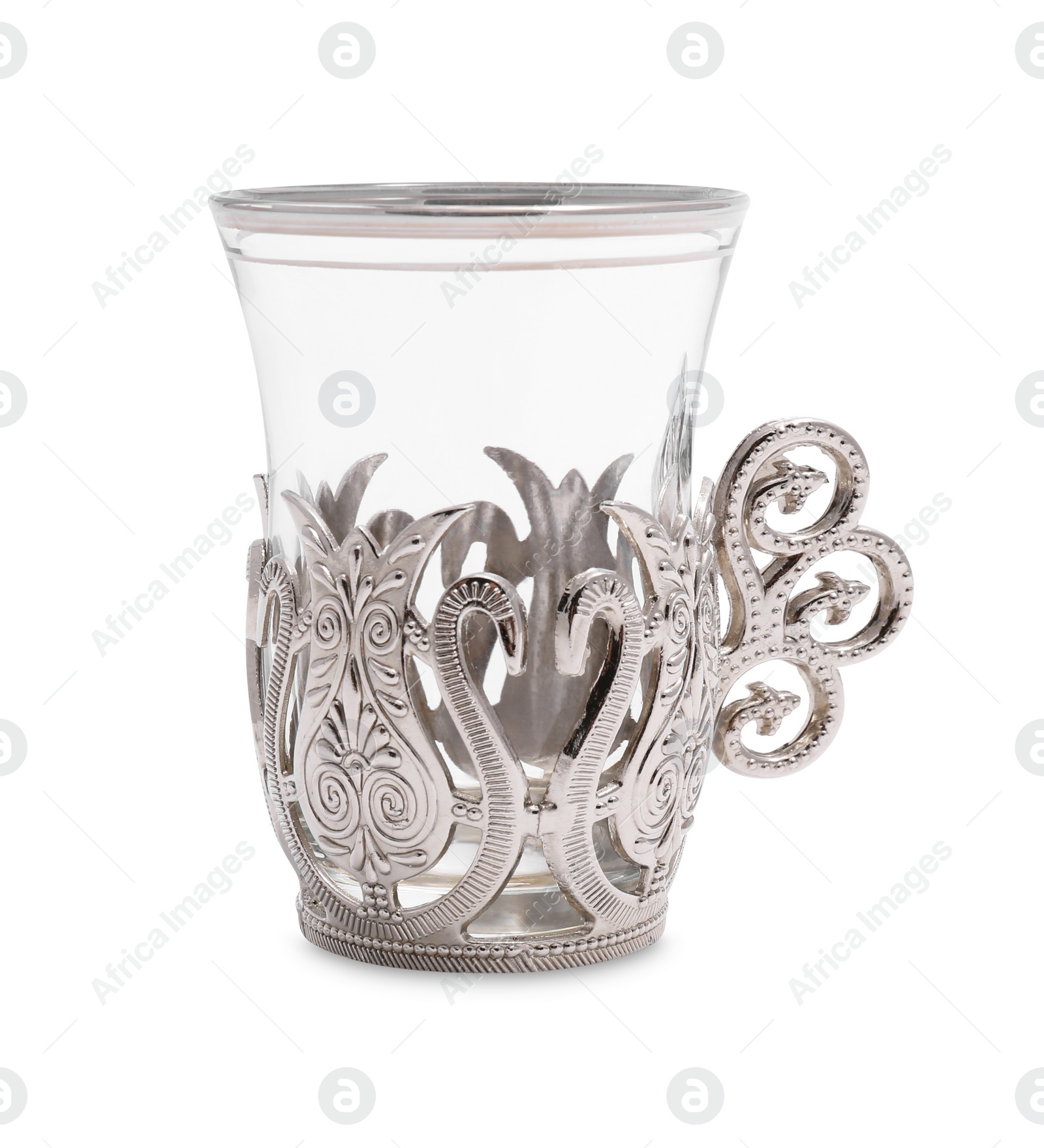 Photo of One glass in vintage holder isolated on white