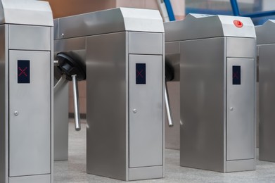 Many modern turnstiles, closeup view. Fare collection system