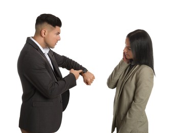 Photo of Businessman pointing on wrist watch while scolding employee for being late against white background