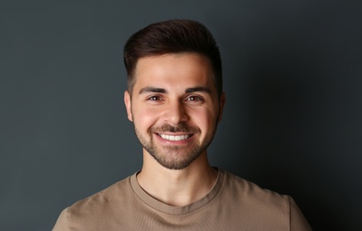 Portrait of handsome man on dark background