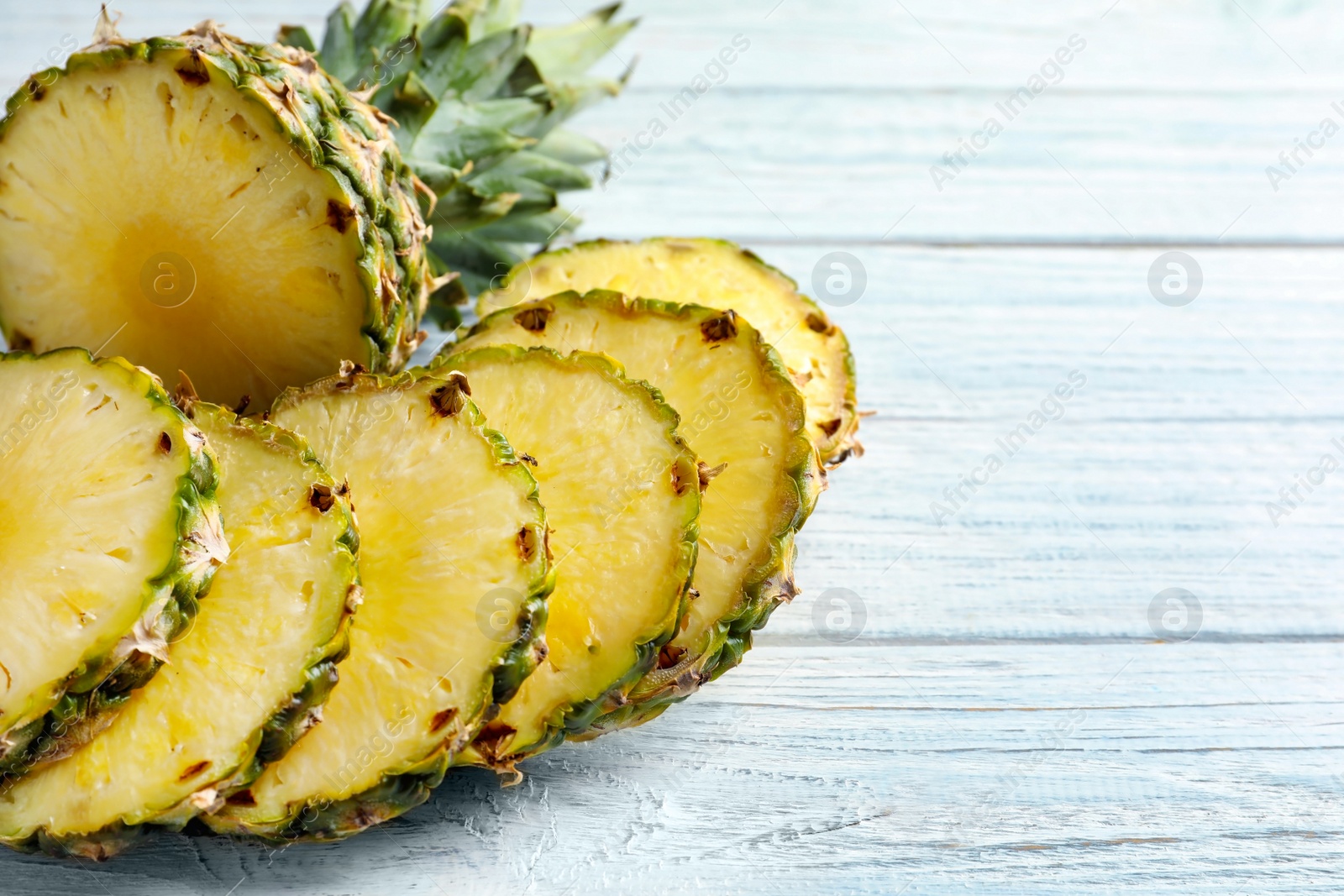 Photo of Fresh sliced pineapple on table, closeup