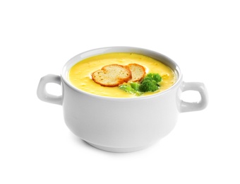 Bowl of cheese cream soup with broccoli and croutons on white background